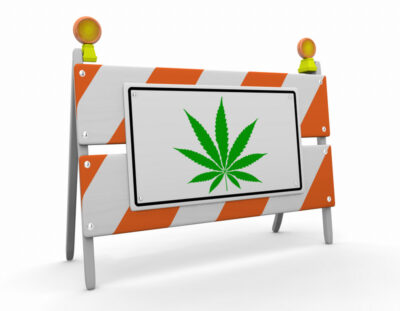 Marijuana Pot Weed Cannabis symbol on a Road Barricade Warning Danger